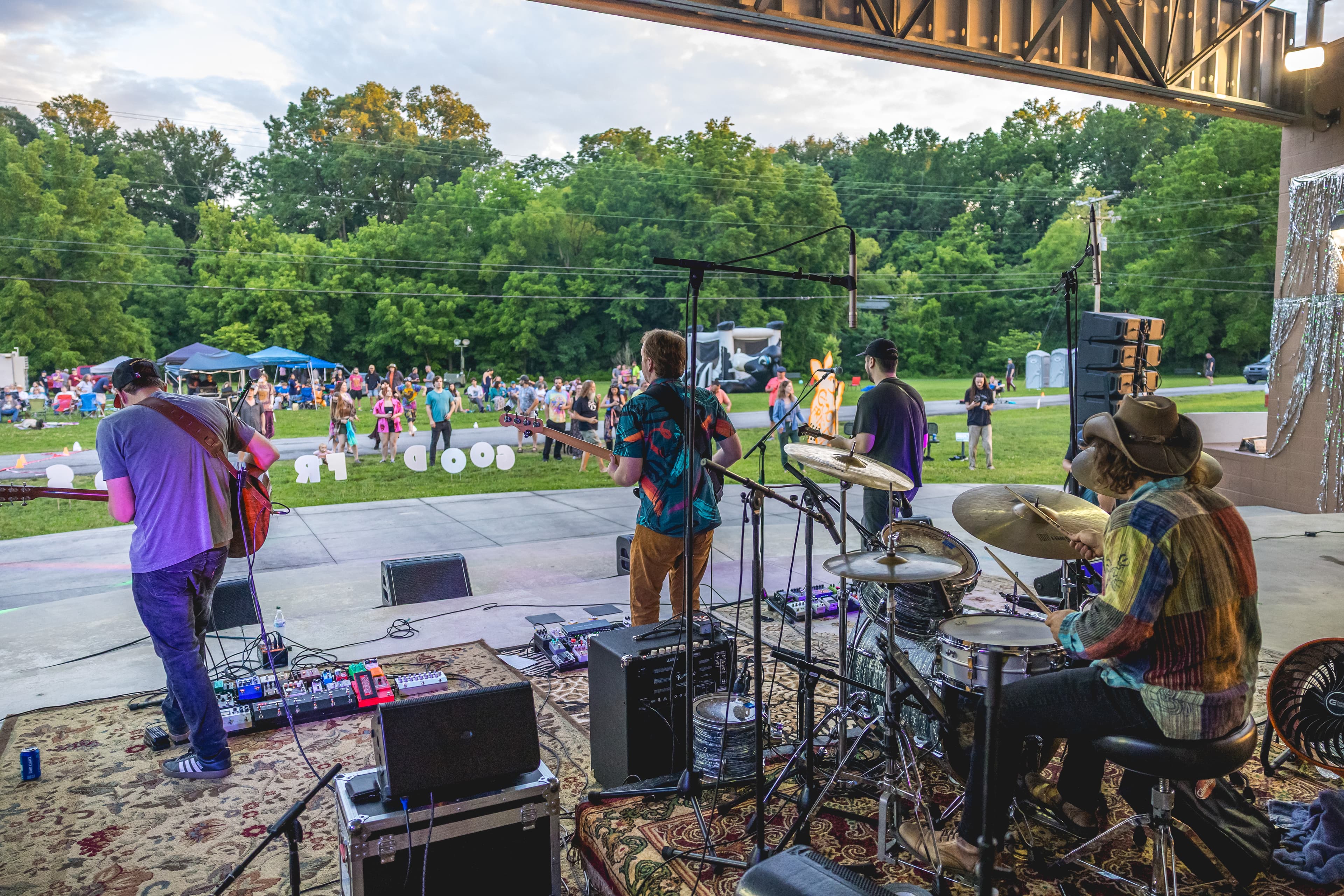 Festival-goers relaxing together on the lawn at Good Friends Music Fest